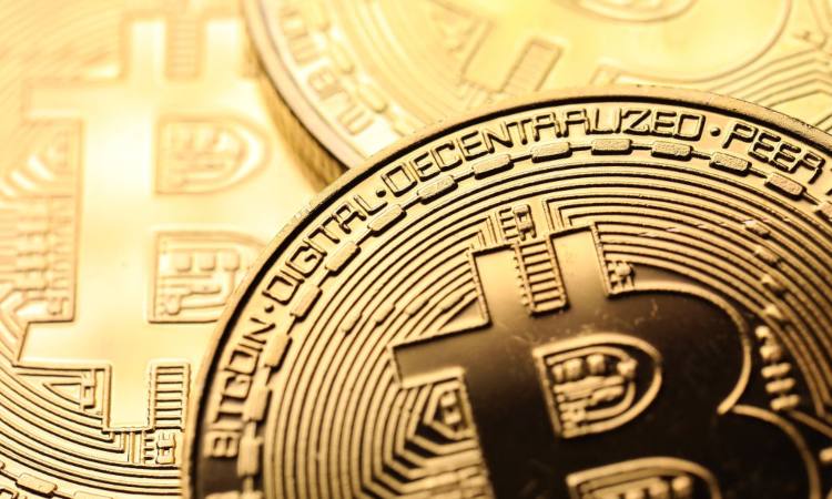 Alcune monete dorate dei Bitcoin